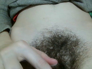 Hairy pussy aside, girl is showing her hair to her boyfriend to impress him.
